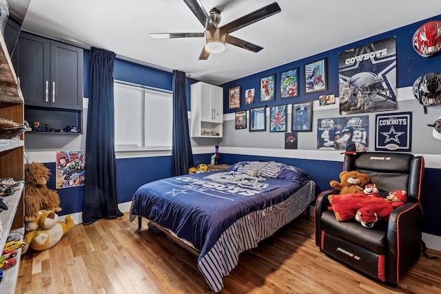 bedroom with hardwood / wood-style flooring and ceiling fan