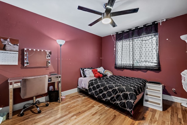 bedroom with hardwood / wood-style flooring and ceiling fan