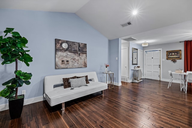 sitting room featuring dark hardwood / wood-style floors and lofted ceiling