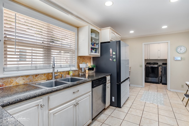 kitchen with white cabinetry, sink, tasteful backsplash, independent washer and dryer, and appliances with stainless steel finishes