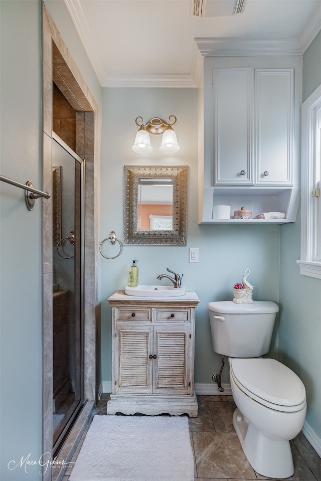 bathroom with vanity, an enclosed shower, and ornamental molding