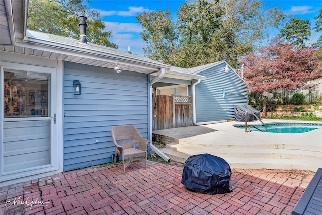 view of patio / terrace with an outdoor fire pit