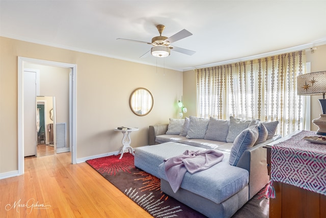 living room featuring crown molding, ceiling fan, and hardwood / wood-style flooring