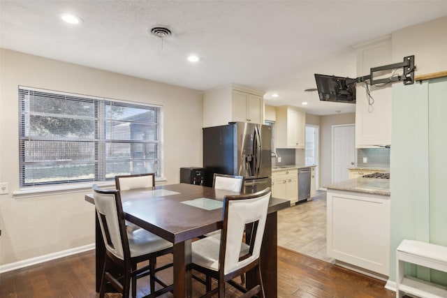 dining room with dark wood-type flooring