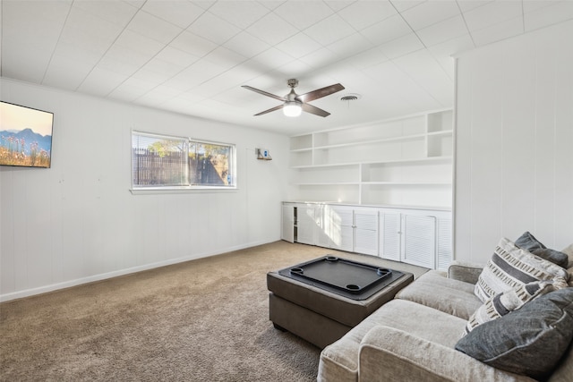 living room featuring carpet floors and ceiling fan