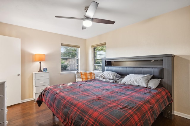 bedroom with ceiling fan and dark wood-type flooring