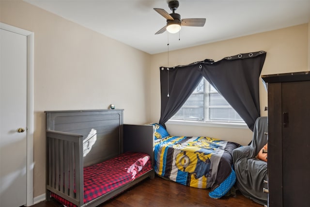 bedroom with wood-type flooring and ceiling fan