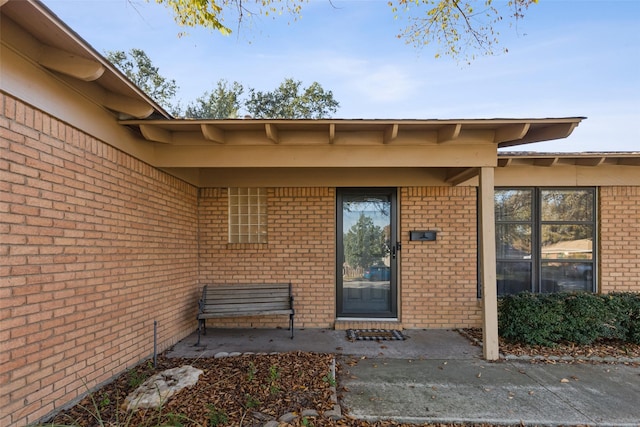 doorway to property with a patio area