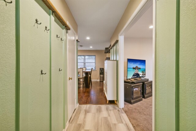 hall with light wood-type flooring