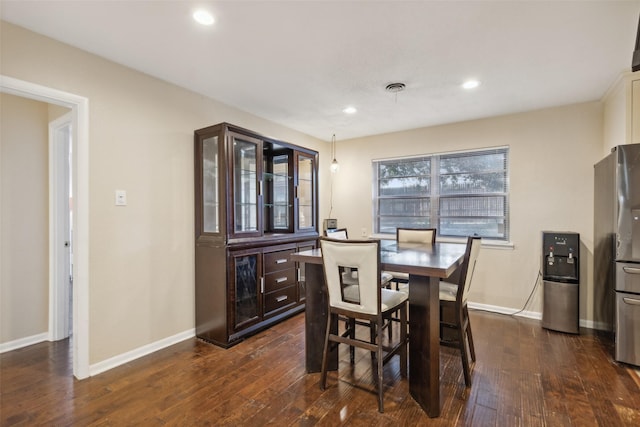 dining room with dark wood-type flooring