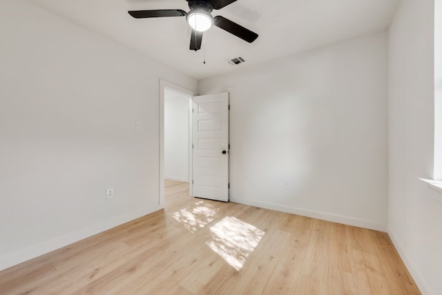 spare room with light hardwood / wood-style flooring and ceiling fan