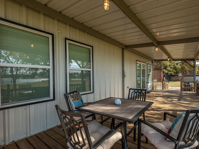 wooden terrace with outdoor dining area