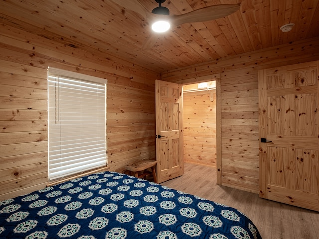 unfurnished bedroom featuring ceiling fan, wood walls, wood-type flooring, and wood ceiling