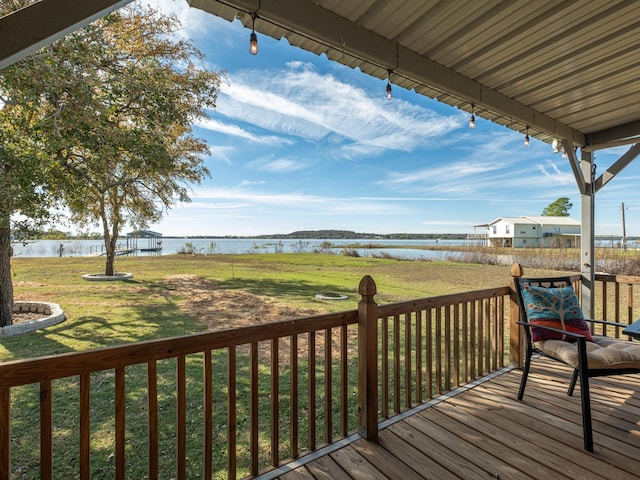 deck featuring a yard and a water view