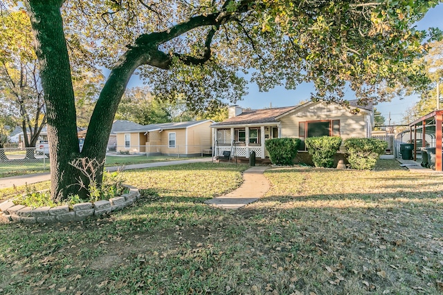 single story home with covered porch and a front lawn