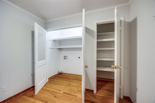 laundry room with washer hookup, electric dryer hookup, ornamental molding, and light hardwood / wood-style flooring