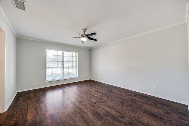 empty room featuring ceiling fan, ornamental molding, and dark wood-type flooring