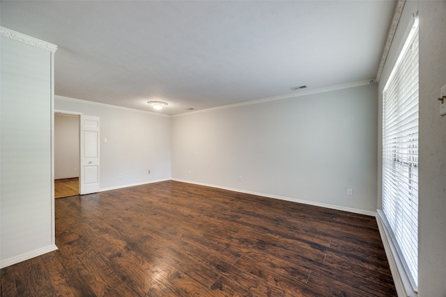 unfurnished room with crown molding and dark wood-type flooring