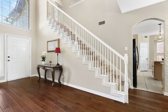 entrance foyer featuring a wealth of natural light and hardwood / wood-style flooring