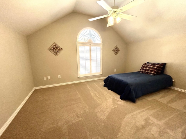 carpeted bedroom with lofted ceiling and ceiling fan