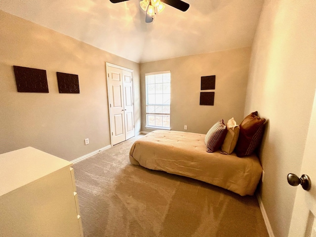 bedroom with ceiling fan and carpet floors