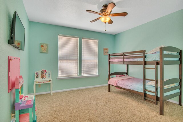 bedroom with ceiling fan and carpet