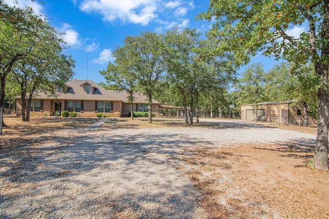 view of front of home with an outdoor structure