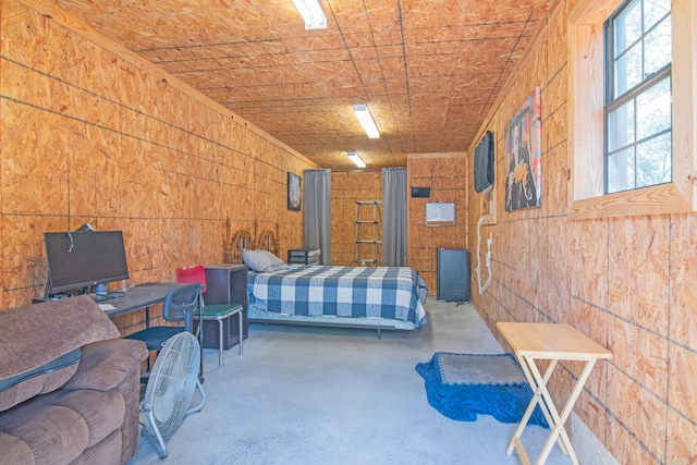 bedroom with concrete flooring