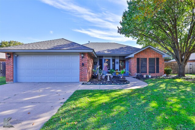 single story home featuring a garage and a front yard