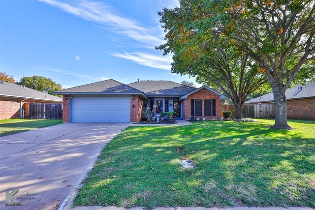 ranch-style home featuring a front lawn and a garage