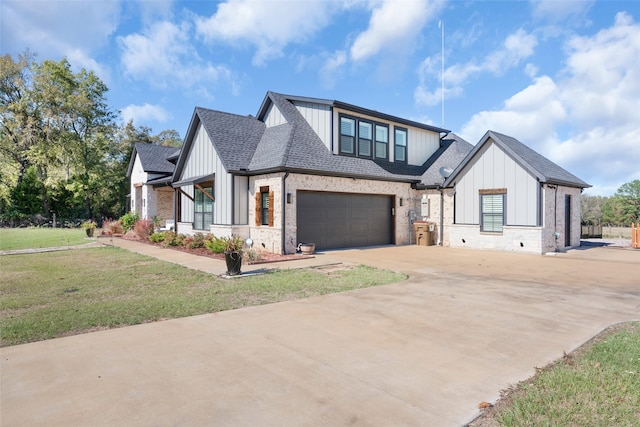 modern farmhouse featuring a garage and a front yard