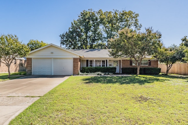 ranch-style home with a garage and a front yard