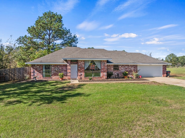 ranch-style house featuring a front yard and a garage