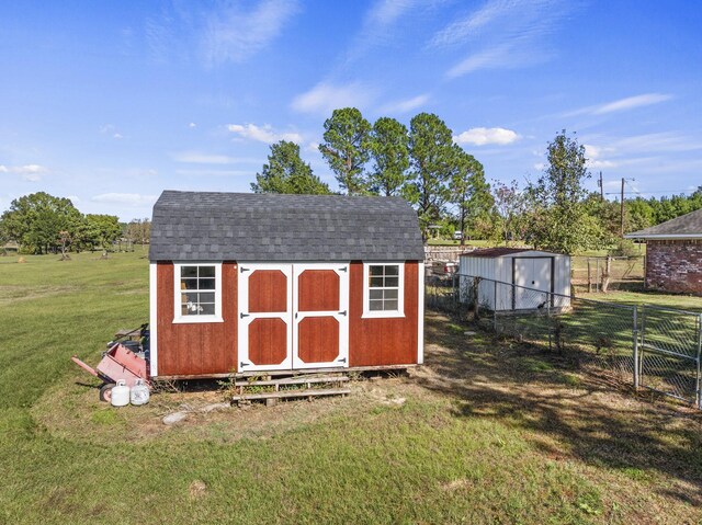 view of outbuilding with a lawn