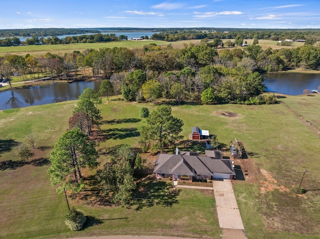 birds eye view of property featuring a rural view and a water view