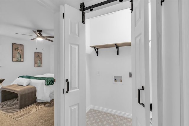 interior space featuring ceiling fan, light carpet, and hookup for a washing machine