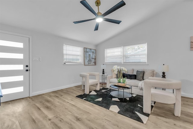 sitting room featuring ceiling fan, vaulted ceiling, and light wood-type flooring