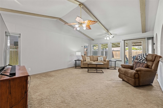 living room featuring carpet flooring, lofted ceiling with beams, and ceiling fan