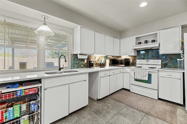 kitchen featuring electric stove, white cabinetry, sink, and pendant lighting