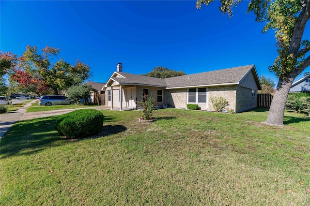 ranch-style home with a front yard and a garage