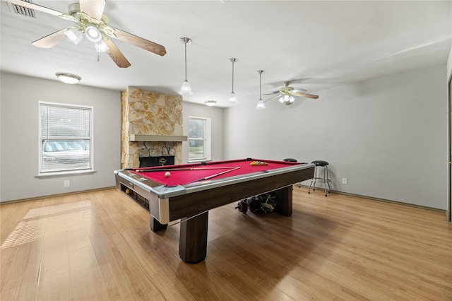 game room featuring hardwood / wood-style flooring, billiards, and a wealth of natural light