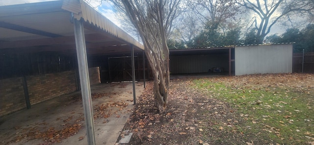 view of home's exterior with an outdoor structure