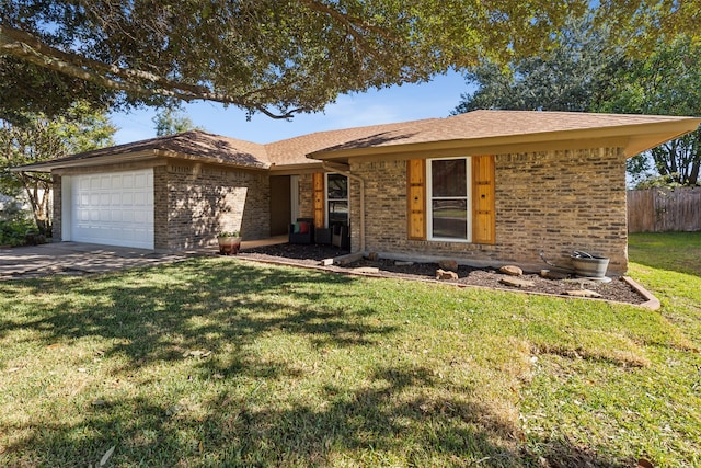 ranch-style house featuring a front lawn and a garage