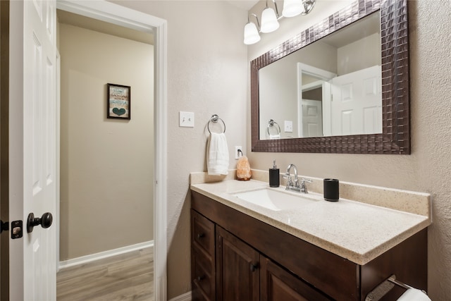 bathroom featuring hardwood / wood-style floors and vanity