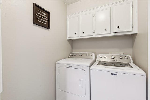 laundry room featuring cabinets and independent washer and dryer