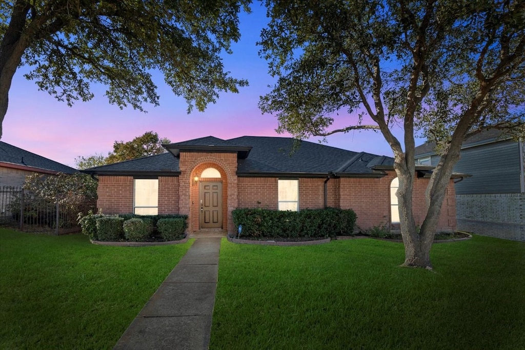 view of front of property with a yard