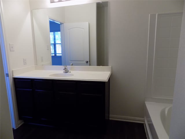 bathroom featuring a bathtub and vanity