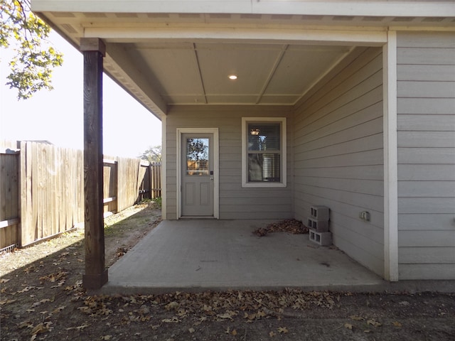 property entrance featuring a patio area