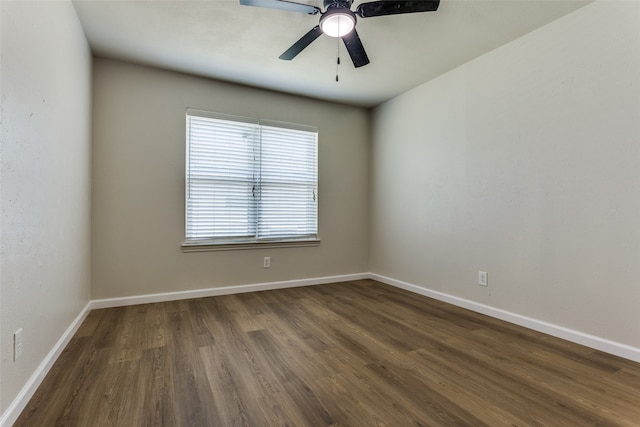 unfurnished room featuring dark hardwood / wood-style flooring and ceiling fan