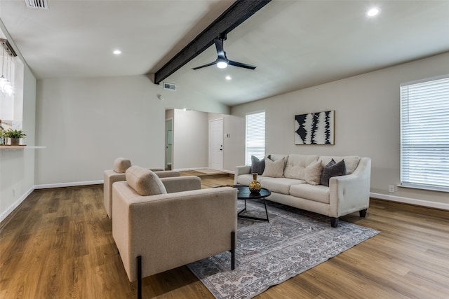 living room featuring wood-type flooring, vaulted ceiling with beams, and ceiling fan